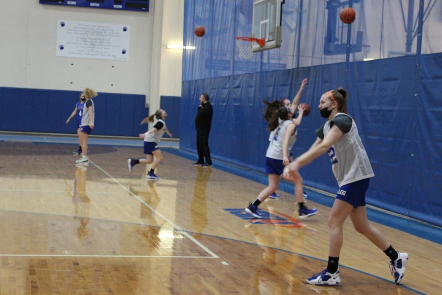 The girls basketball team practices for their upcoming holiday tournament taking place in the end of December. The tournament will include teams from various schools. 