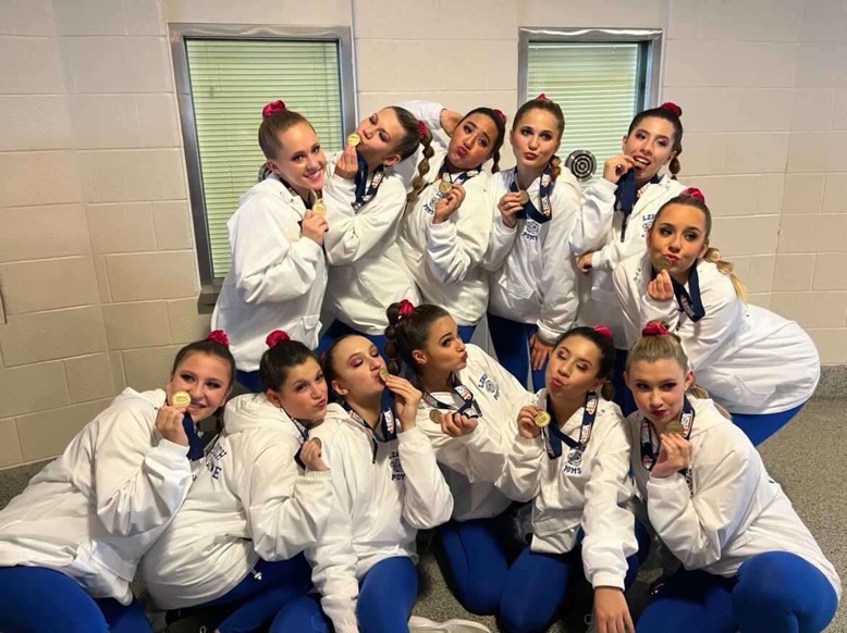 LZHS Poms members hold up their medals after placing first in state. 