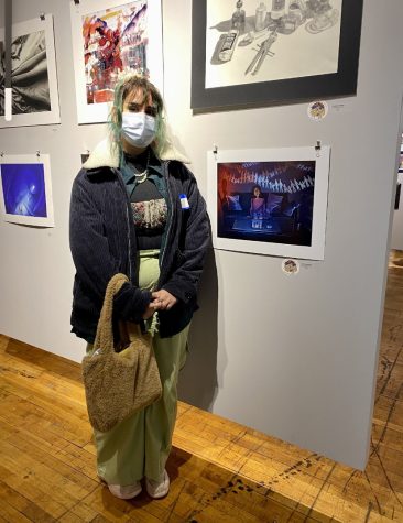 Niya Katsarska, senior, poses with her exhibited art.