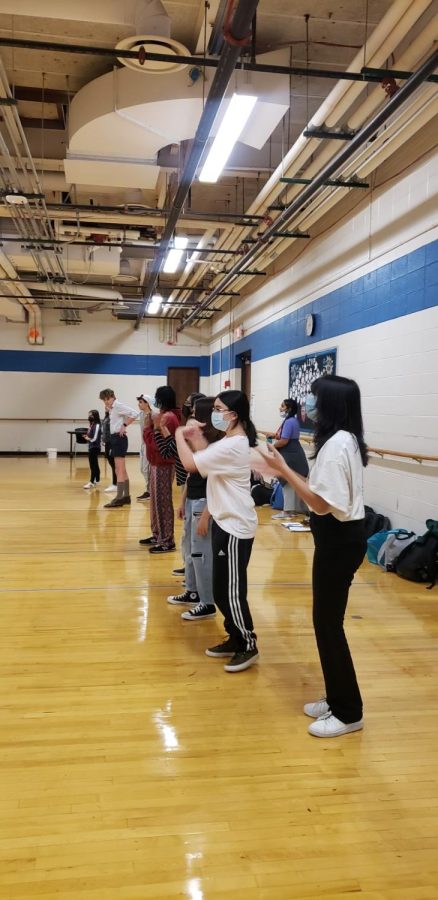 Members of Kinection practice a routine to a K-pop song. Most of their meetings are centered around dancing.