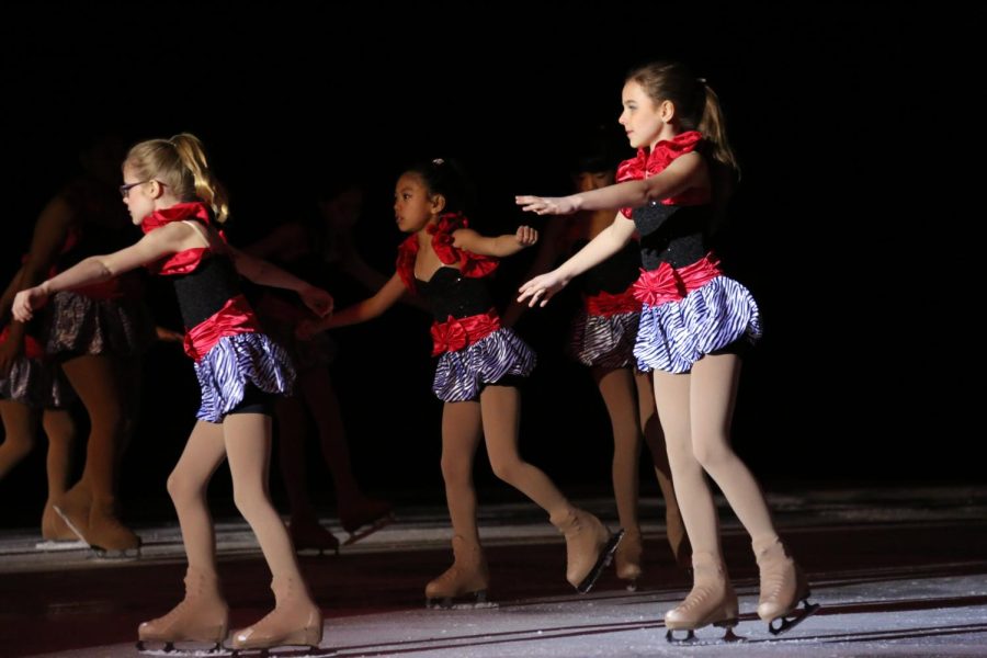 Czarnik is shown figure skating with friends at a recital when she was younger.