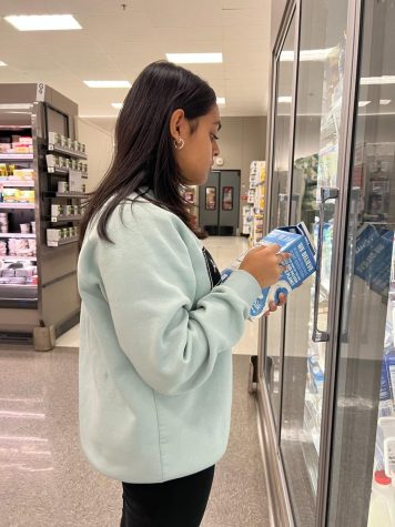 Sashrika Shyam, junior, checking the ingredients of non-dairy milk. This has become a common practice every time I am at a grocery store.