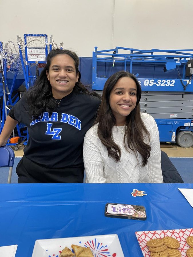 Shloka Rao and Priya Ravella advertise the South Asian Student Association at the Freshman activity night on February 2. Rao and Ravella are the presidents of the new South Asian Student Association at LZHS. 