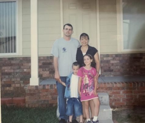 Sammie Collins, senior, and his family at their old home in Kansas. Collins still visits his old homes from time to time.