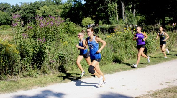 Hannah Gilhaus, sophomore, runs at her cross country meet as her first year on the team.
