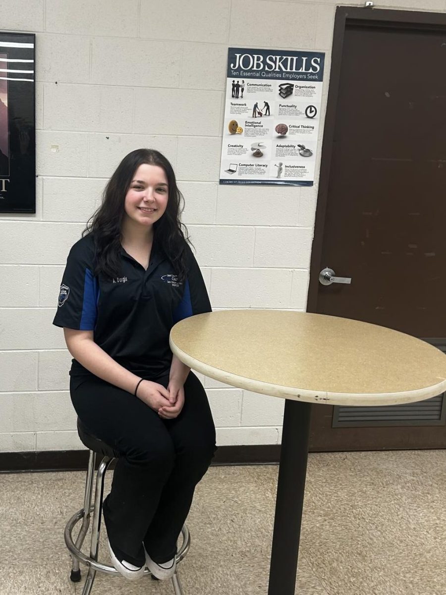 Amelia+Dargis%2C+senior%2C+sits+in+the+Tech+Campus+with+her+polo+shirt+uniform.+Tech+students+report+to+the+College+of+Lake+County+everyday.