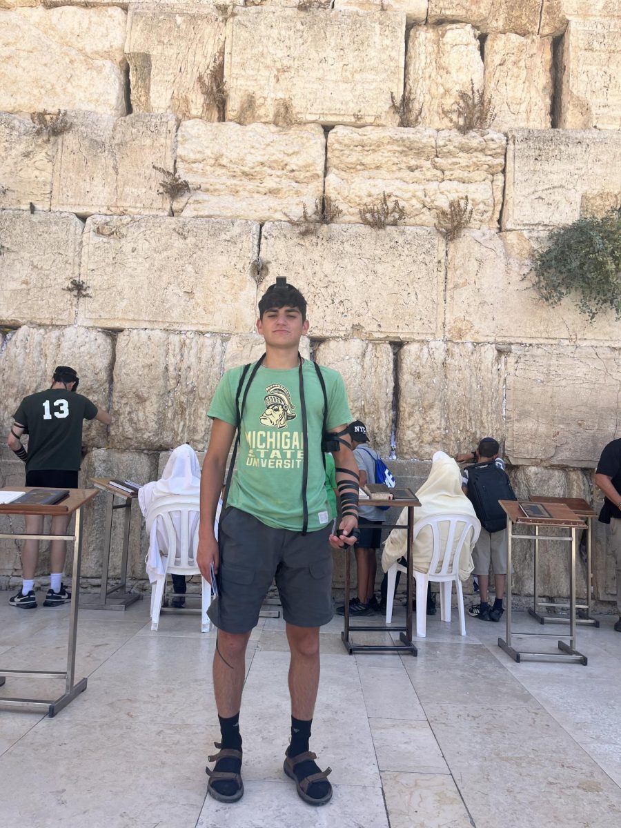 Kamin stands in front of the Western Wall of Jerusalem, the most holy site in all of Israel for the Jewish people. 