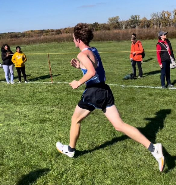 Leitz runs during a cross country meet at Palatine High School. Leitz says he likes the design of his uniform. 