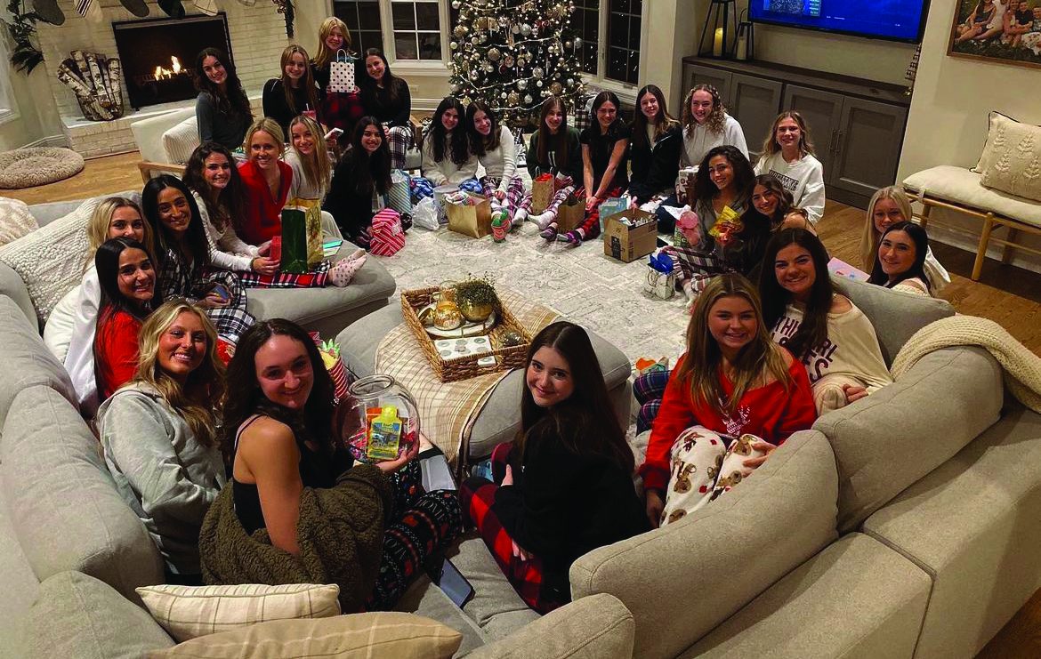 Last winter, the poms team gathered around the fireplace in their pajamas during their annual Christmas party. They open gifts and tell fun stories with each other.
