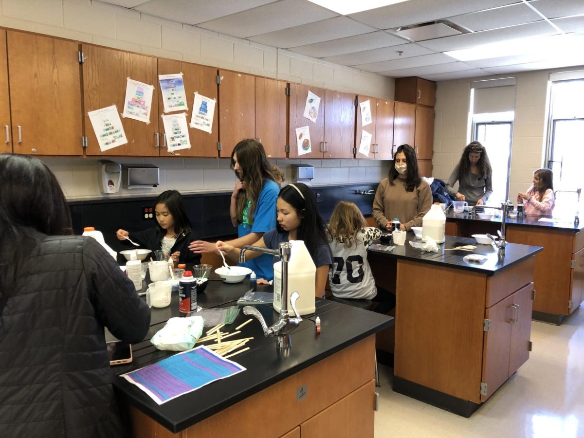 High school students help younger students participate in hands on science experiments at D95’s SteamPossible event. Though SteamPossible was a science event, the 2024 science fair was the first one the district put on since before the COVID-19 pandemic.