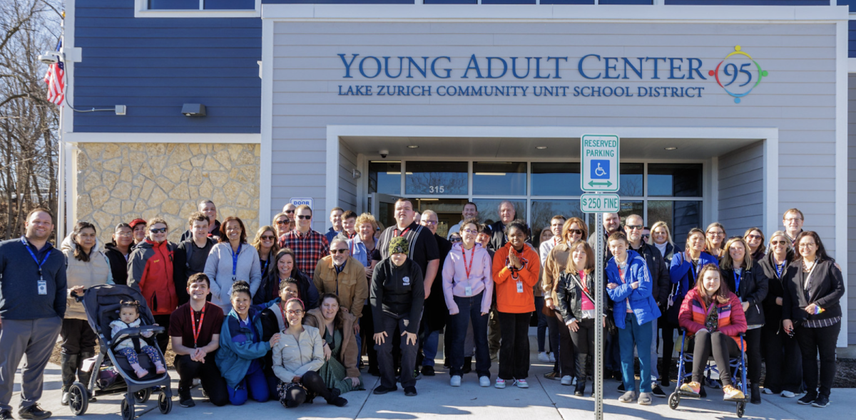 Students, staff, pose in front of new Young Adult Center for students with IEP’s aged 18-22 who elect to stay on for transition services. The 25 students and staff in the program moved into the three-story building on March 6.