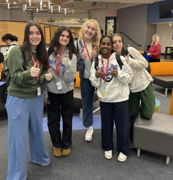 Several members show their smiles after one of the first of many meetings. Anna Roscoe, Grace Karstens, Anna Gilbertson, Amulya Monangi, Sophia Patrinos (all seniors pictured left to right).