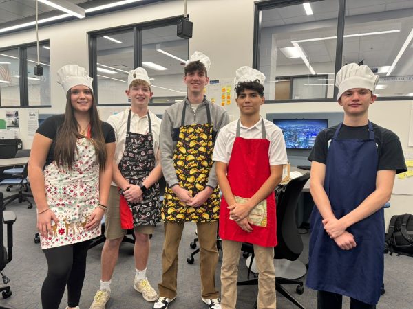 Colin Smith, senior, poses with his INCubator business group. While the group faced some challenges getting along at the beginning, according to Smith, theyve grown closer as time went on.