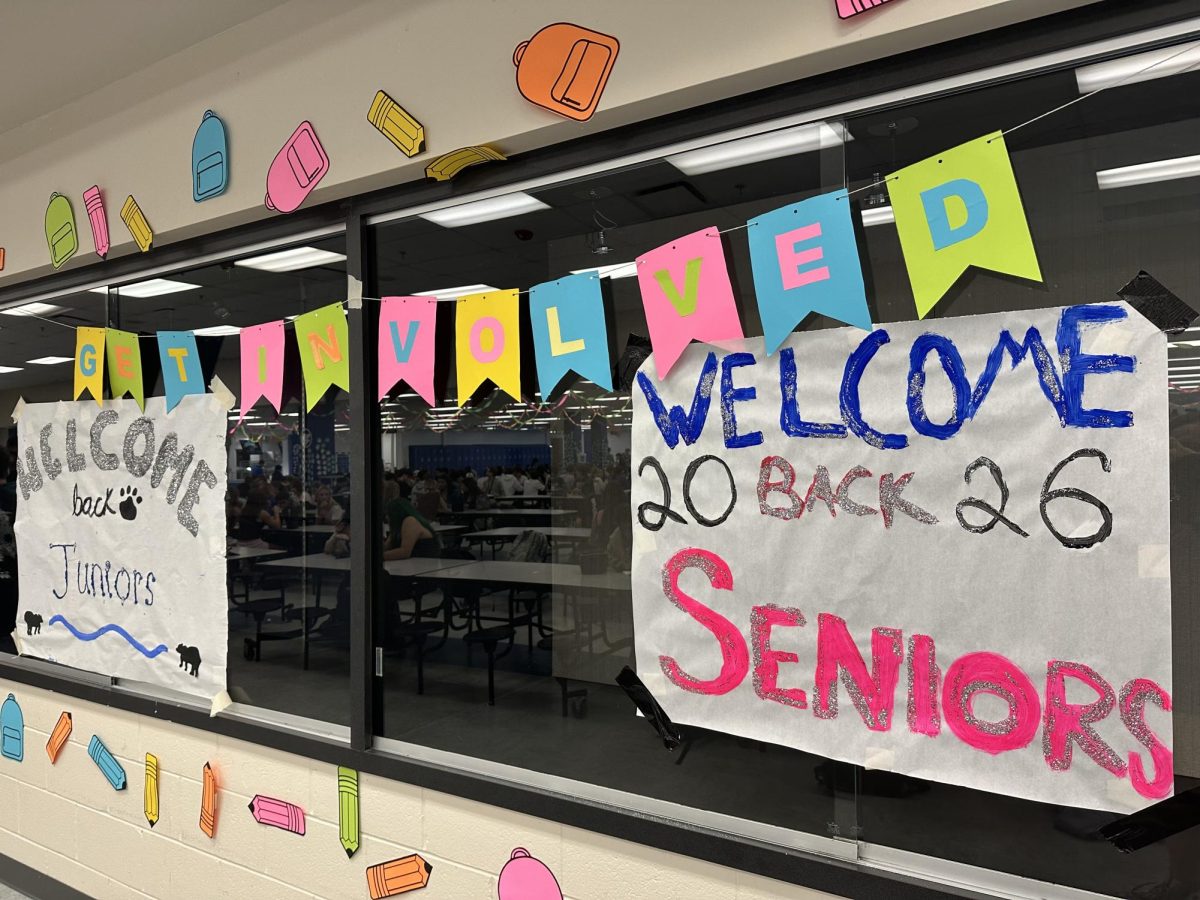 Signs in the cafeteria welcoming back seniors and juniors. Student council decorated for each different year seperately, allowing each grade to feel welcomed.